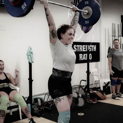 One of our clients, Colleen, lifting during our 2019 Athlete Camp.