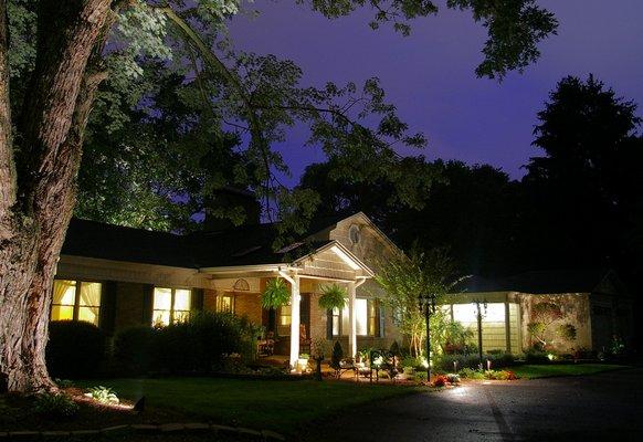 Front view of Inn at night with uplighting.