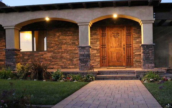 Landscape design and build covered patio with stone and pavered walkway