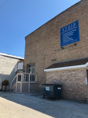 The main entrance which is located behind the main building. This is the rear entrance of the Old Klines building.