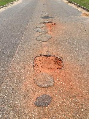 Even more potholes on back road.