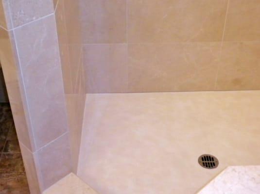 Custom Concrete Shower floor to match Marble tile.