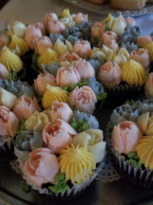 Cupcakes beautifully decorated to celebrate our Mom's birthday. They made a stunning display. :)