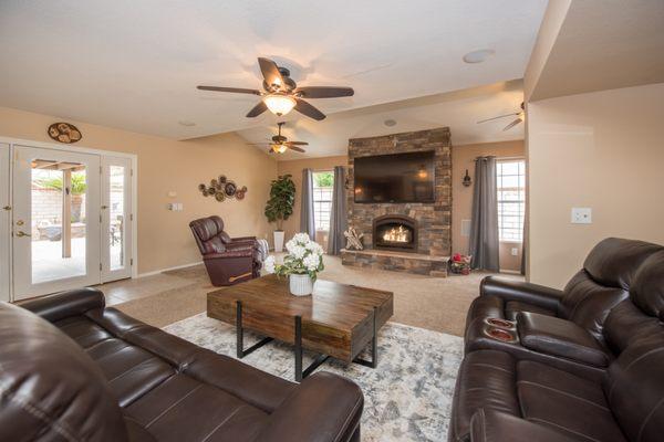 Living room with large custom floor-to-ceiling fireplace.