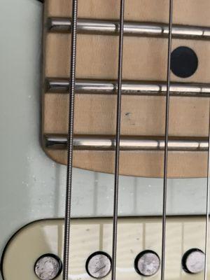 Damage to maple neck from Butler.   I think a 12 year old does their customer service.   Rude, disrespectful, and arrogant.