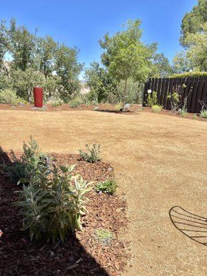 Gravel garden w/ water feature beyond