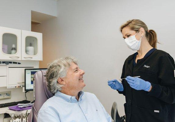 Hygienist Paige with a patient.