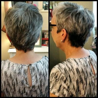 A woman's short hair cut, with soft feminine details!