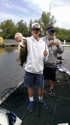 My son and one of his many bass we caught with Vince