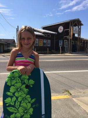 Lily enjoying a day surfing at the beach with Moment Surf Shop