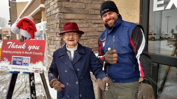 Catherine Lykken and Ben Goldberg ringing the bell for United Way! Coldwell Banker Distinctive Properties- Distinctive Angels