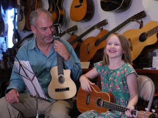 A young ukulele student in her lesson. Photo: Lisa Strong.