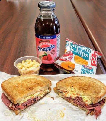 Pastrami w/melted Swiss, Russian dressing, and coleslaw on rye, macaroni salad, drink, chips. All of this for just $7.49. So good!!!!!!!