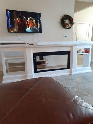 1/2 finished free standing electric fireplace.