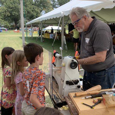 Mid South Woodturners Guild making free tops for youth.