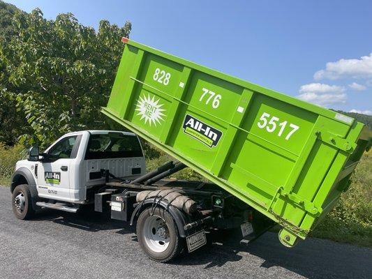 Delivery truck and dumpster