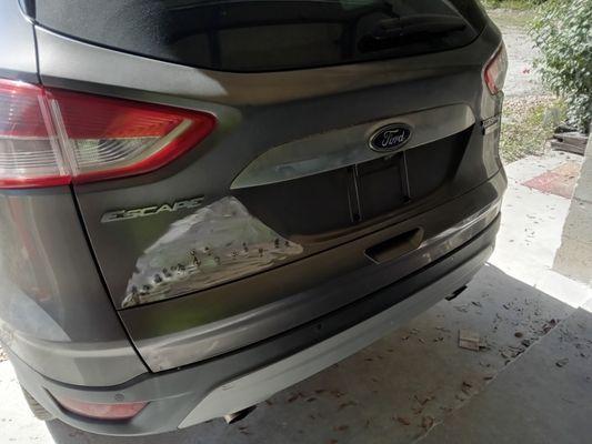 Pulling out the metal on the tailgate and getting it straight so it can be ready for paint