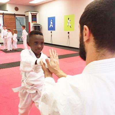 Sensei Neil teaches a new student in our Intro class