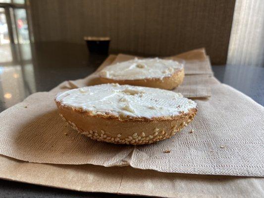 Sesame seed bagel with plain spread.