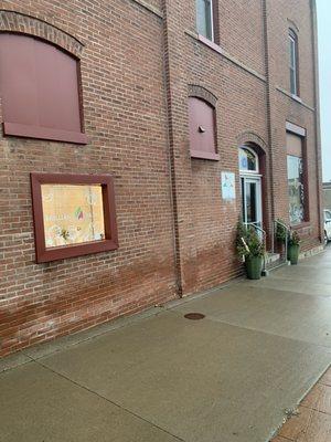 Brilliant Skin's entry door from Central Ave/ Hwy25. Off street parking lot for our client's to park in "Tenant Parking Only" spots.