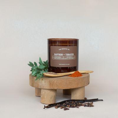 A versatile and bestselling fragrance. Our Saffron + Tobacco 8oz soy candle is hand-poured by survivors of trafficking in Fort Worth, TX.