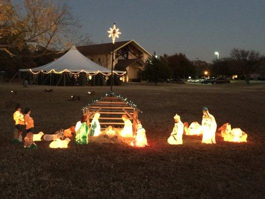 Display in front of the church during the Christmas tree sale. Christ is born!