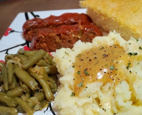 Meatloaf ,green beans,mashed potatoes and gravy sweet corn bread