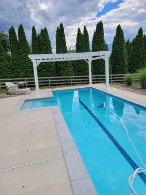 Pergola assembly over pool