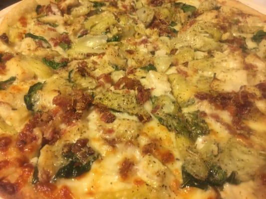 Thin crust Chicken Bacon Artichoke pizza after cooking