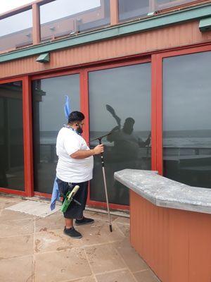 Cristian cleaning windows