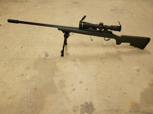 Remington 700 with added muzzle brake and Leupold scope