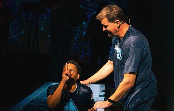 Pastor Troy Knight baptizes young man at Generations Church in Southport, NC.