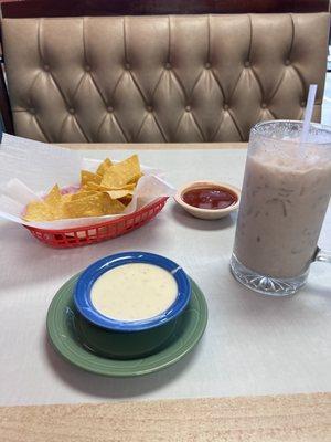 Queso dip (cheese dip), horchata, chips and salsa