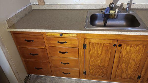 The original cabinets did have a pull out cutting board that had disappeared over the years