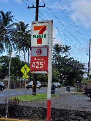 The sign with the 7-Eleven, & 76 Gas Station.