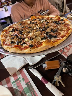 Meat lovers pizza with onion and olives