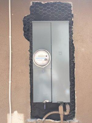 Stucco repair around electrical panel