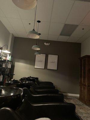 The relaxing wash station - sectioned off from the rest of the salon with comfortable wash chairs, atmospheric music, and dim lighting.