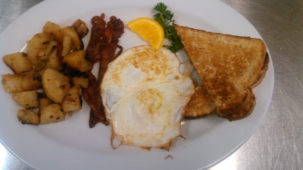 2 Eggs over easy, toast, bacon and home made home fries