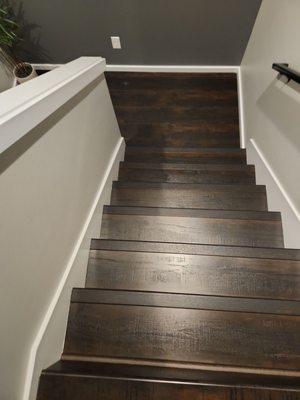 Renovated stairs that match the floor from the rest of the house