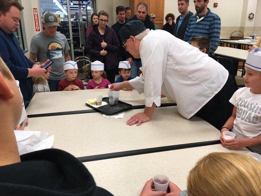 Chef Dan showing the kids how to make cookies.