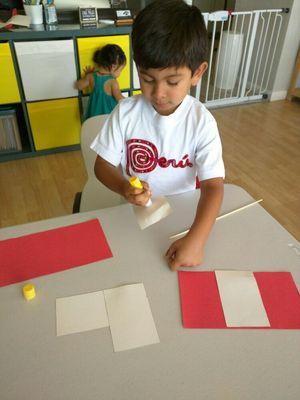 Celebrating Peruvian Independence day makings flags.