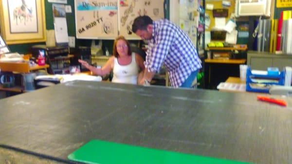 Tonya with a client at The Sign Shop.