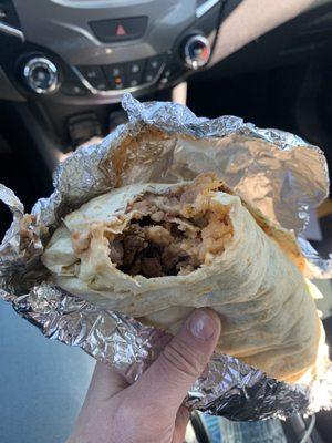 Carne asada burrito with rice and beans inside