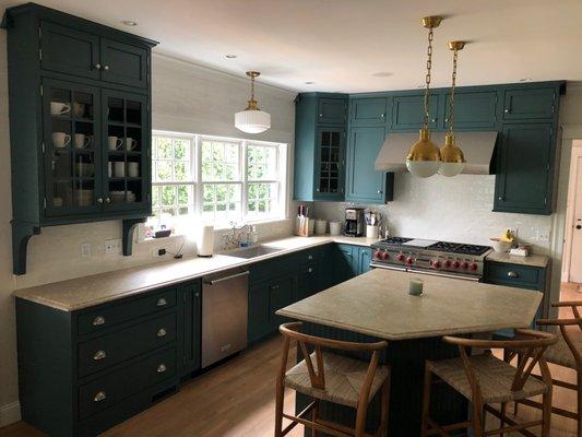 Chris installed these light fixtures and fixed an outlet in our kitchen