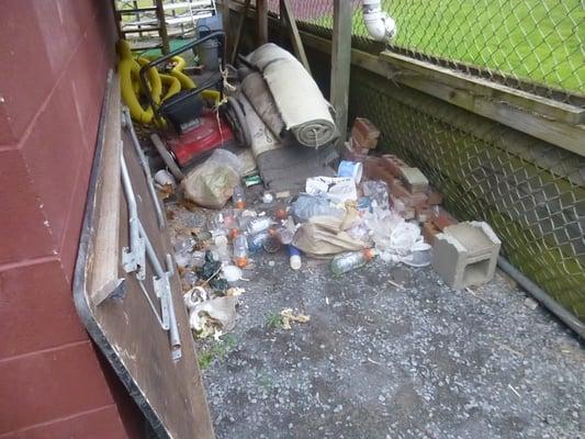 Litters by an audience stand by one of the athletic field