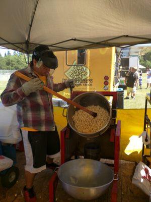 Making a piping hot fresh batch of California Kettle Corn live at an event.