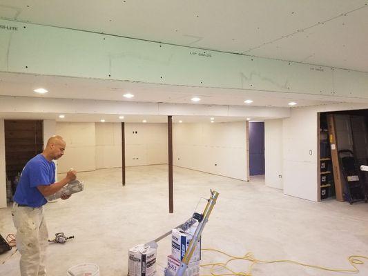 Prefilling the drywall seams prior to taping.