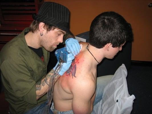 Mikey tattooing.