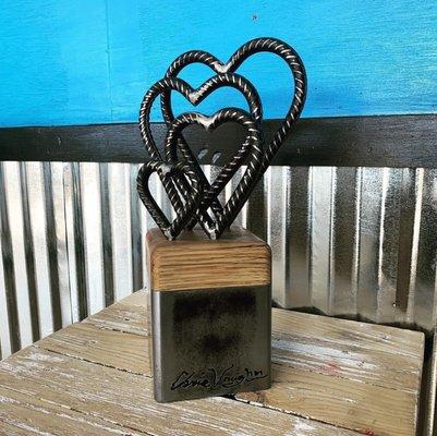 One of a kind, Rebar heart family sculpture from Steel and reclaimed oak.